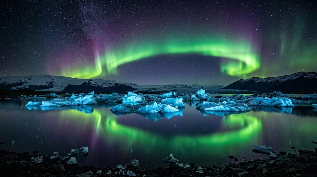 Aurora borealis reflected over icebergs at Jökulsárlón glacier lagoon, Iceland