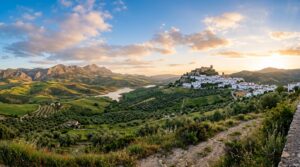 A breathtaking, golden-hour panoramic view of the Andalusian landscape