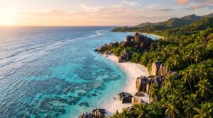 Breathtaking aerial travel photograph of a Seychelles beach at golden hour